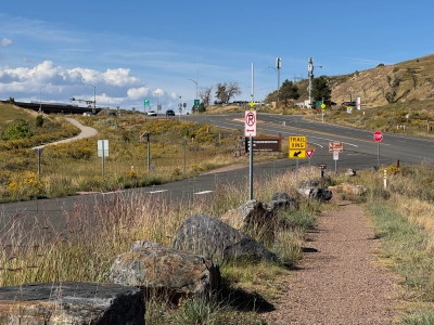 View from the trail at the entrance of Matthews/Winters Park, looking north toward Interstate 70. At least 20 street signs are visible.